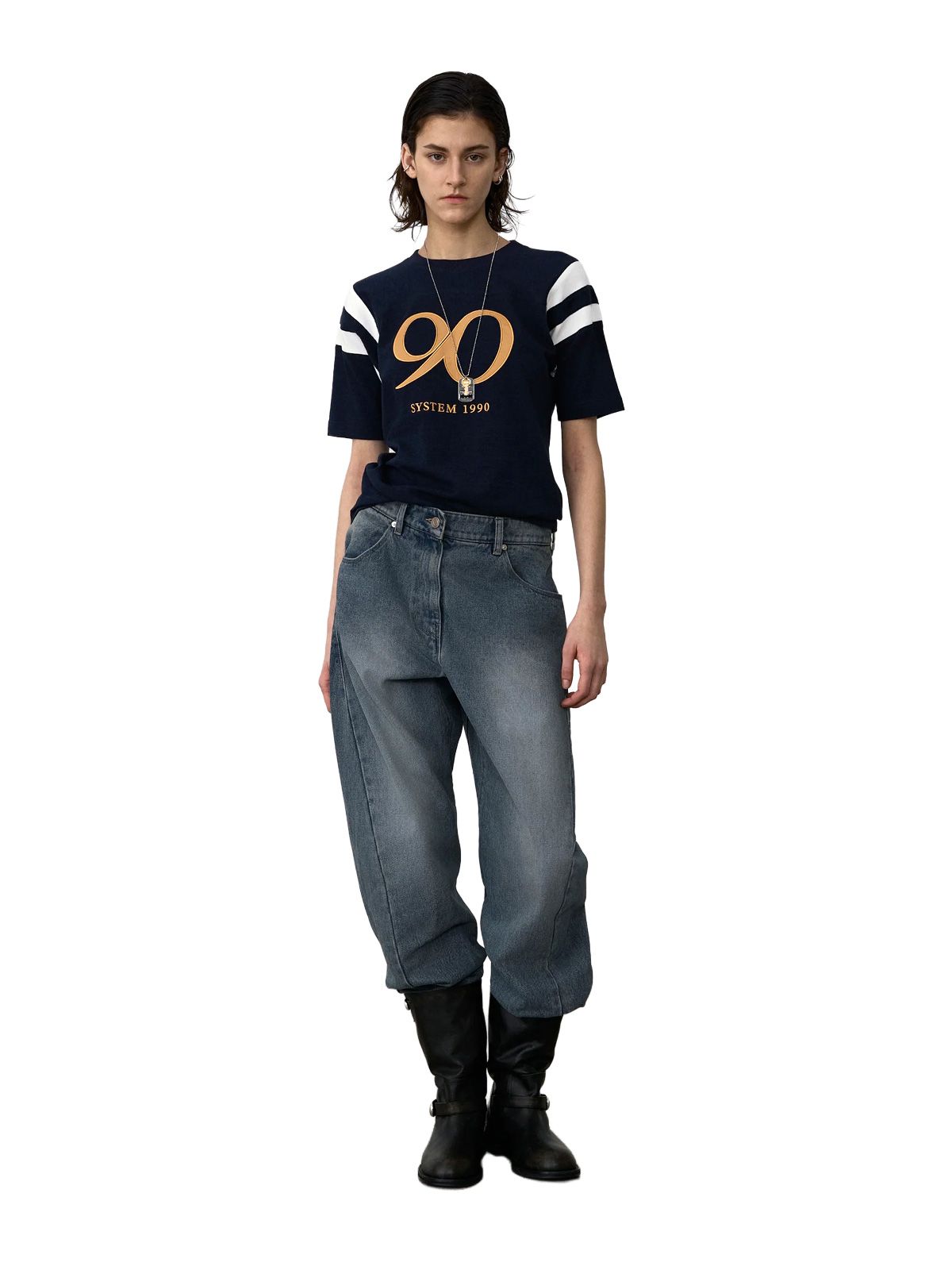 Pantaloni in denim blu con cuciture ritorte SYSTEM